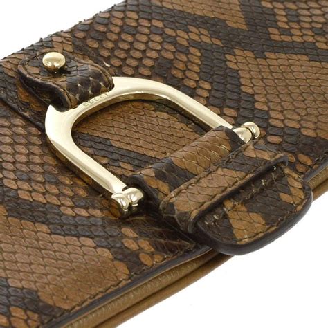 black clutch that looks like gucci|Gucci snakeskin clutch.